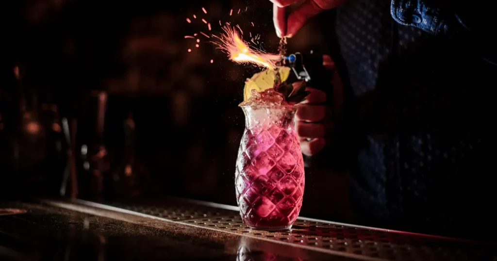 pink coctails in pineapple shaped glass with decorations